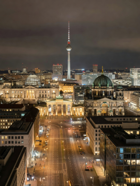 Berlin cityscape illuminated at night with streetlights and architectural landmarks